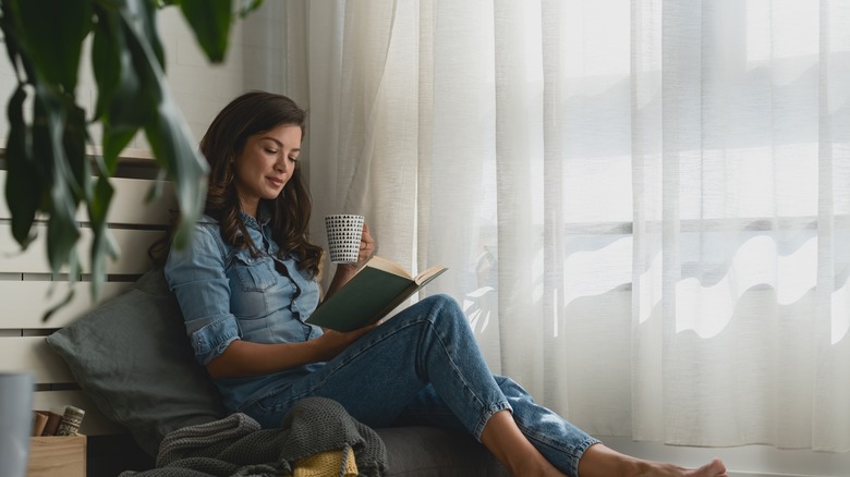 Woman in a reading nook