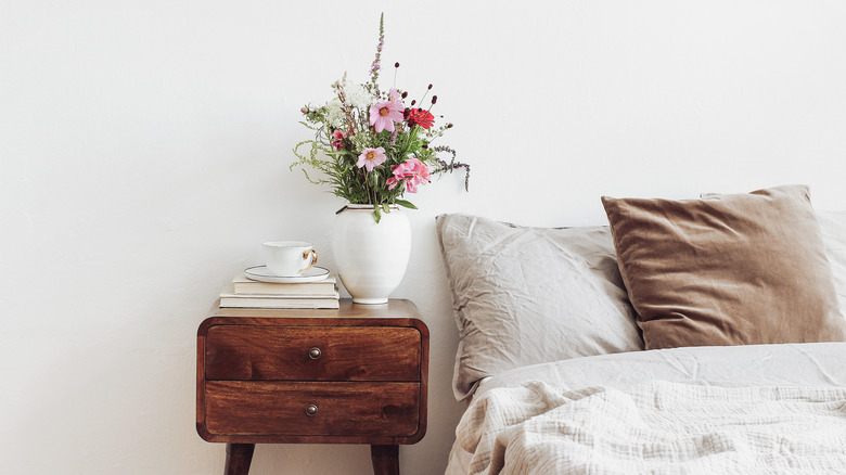 vase of flowers in bedroom