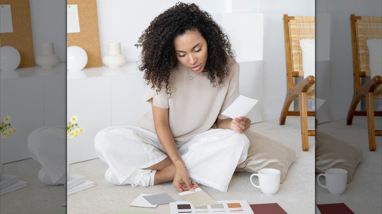Woman looking through color swatches