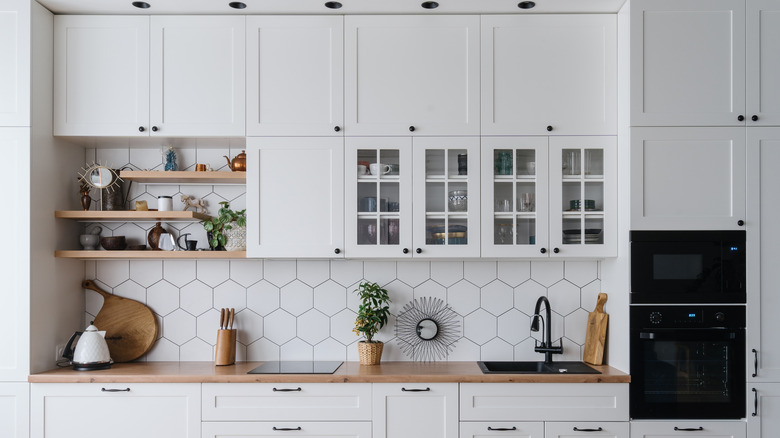 All-white kitchen with black hardware