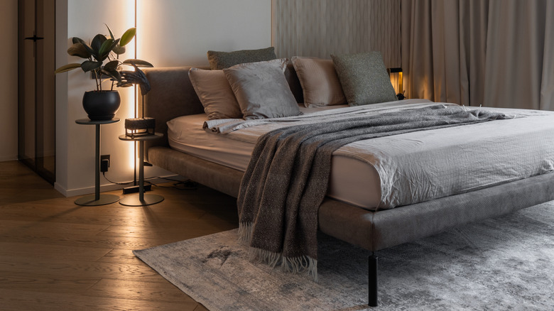 A neutral drenched bedroom in warm gray and beige tones