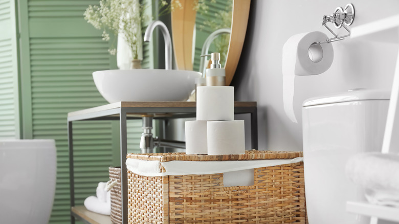 Toilet paper stacked in bathroom