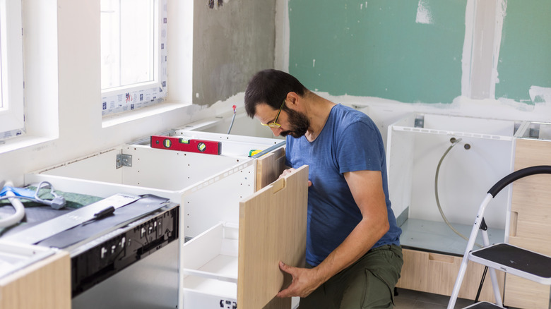 man working on new kitchen