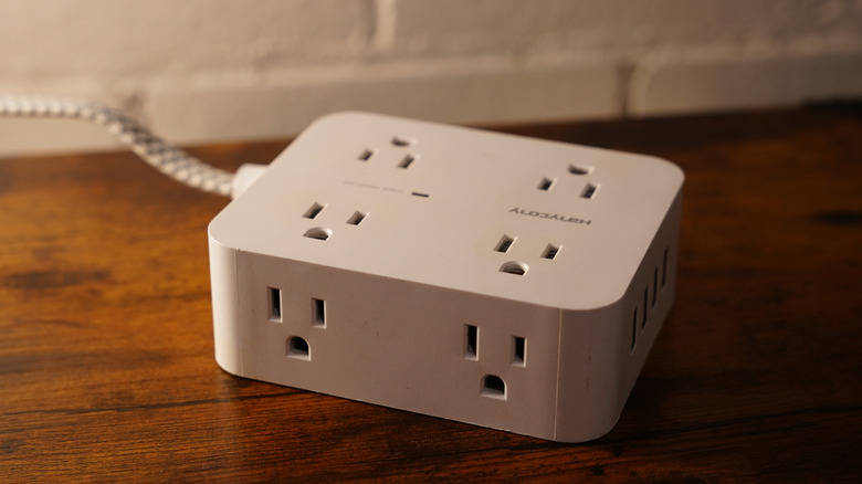 white point of use surge protector on floor