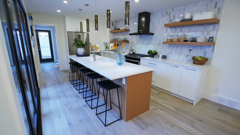 A modern kitchen with a quartz island.