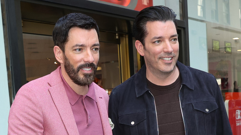 Drew and Jonathan Scott smiling.
