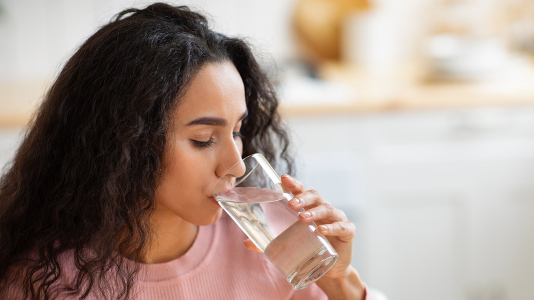woman drinking glass of water