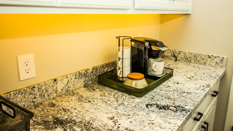 Granite kitchen countertop with coffee tray on top