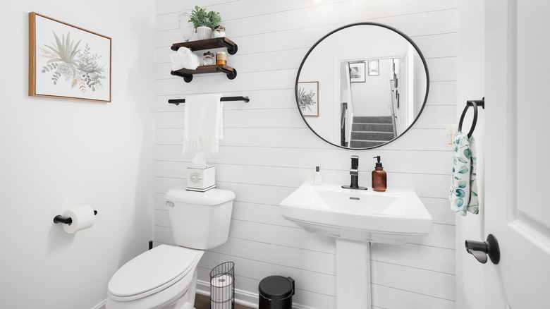 white bathroom with pedestal sink 