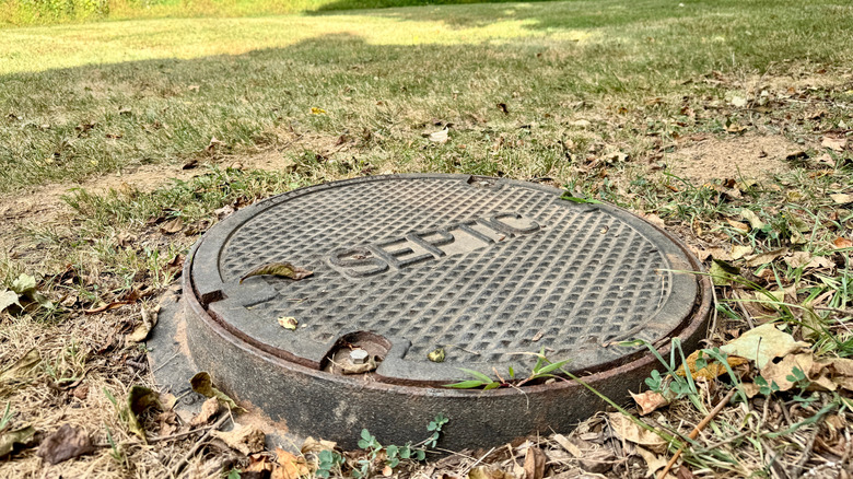 Overhead view of a green septic tank lid