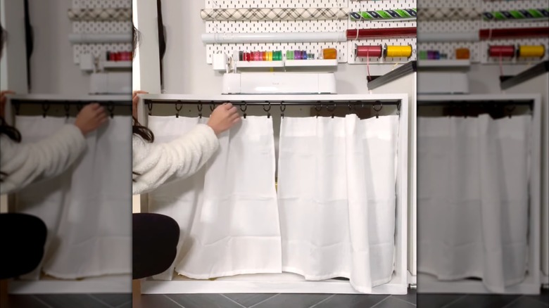 Craft cupboard hidden by curtain