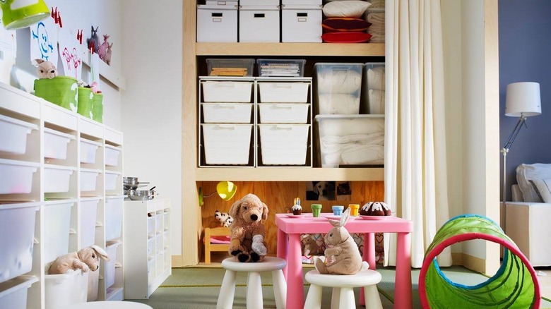 Toy boxes hidden behind playroom curtain