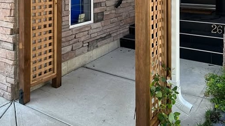 DIY trellis sidewalk arch and downspout support