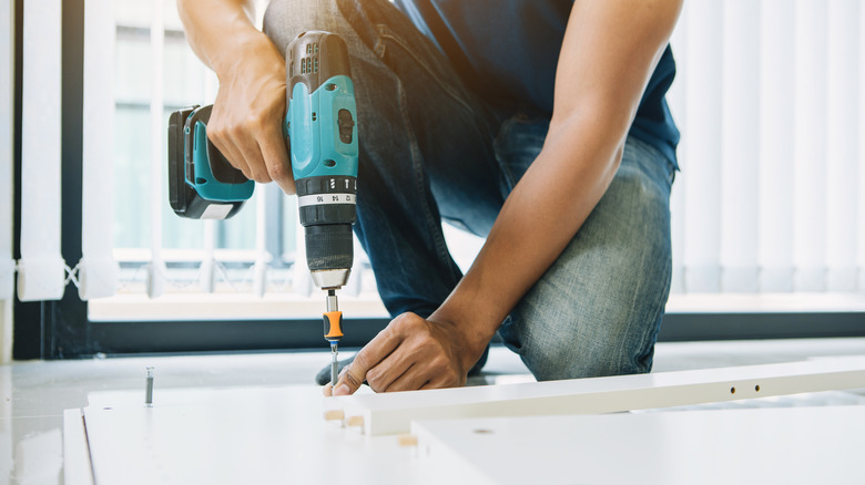 Person assembling furniture