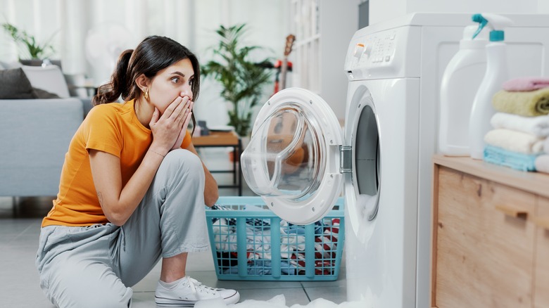 girl looking at damaged machine