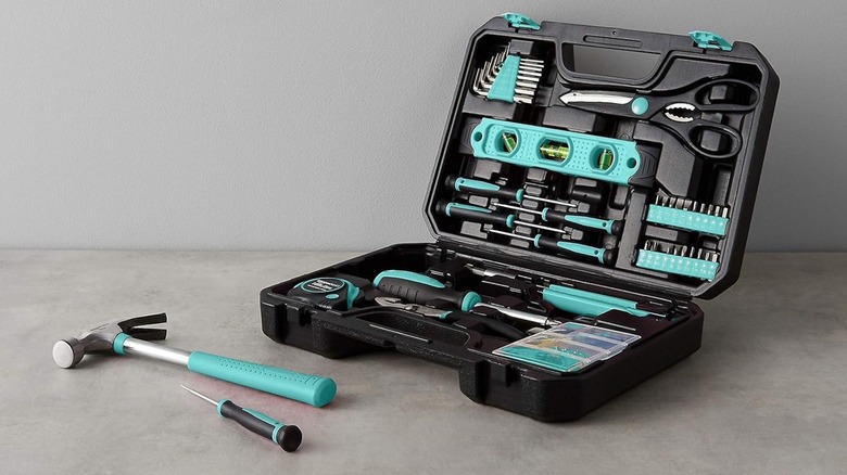 Amazon Basics Household Tool Kit open case on concrete floor