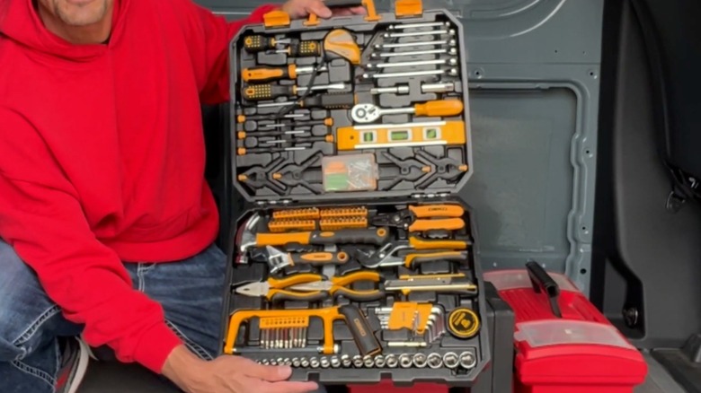 Man holding open DEKOPRO 228 Piece Hand Tool Kit