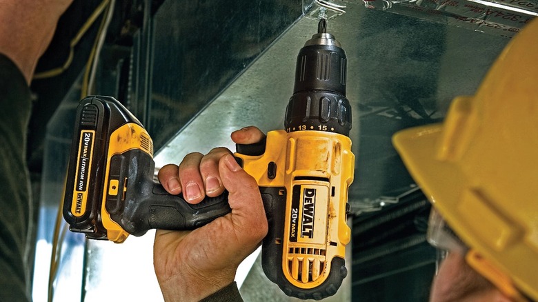 man using DeWalt 20V MAX Cordless Drill on project