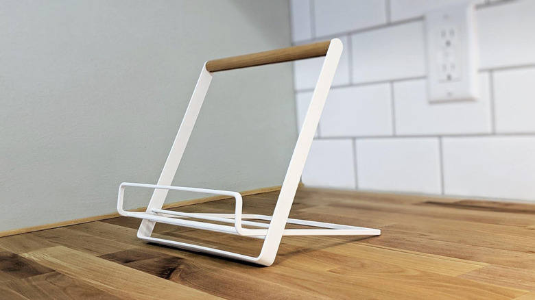 Minimalist modern cookbook stand on empty wood countertop