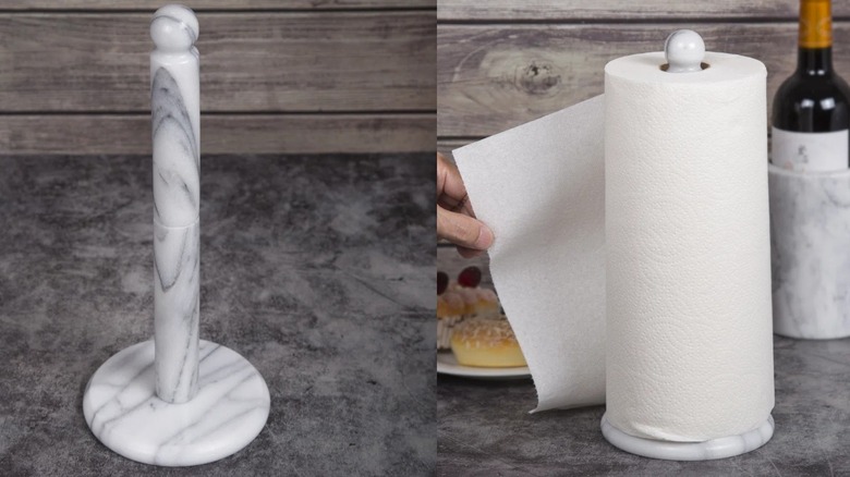 White marble paper towel holder on dark countertop with wood backdrop
