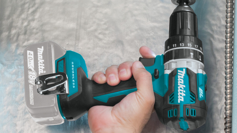 A person using Makita's 18V LXT Lithium-Ion ½-inch Brushless Cordless Hammer Driver-Drill