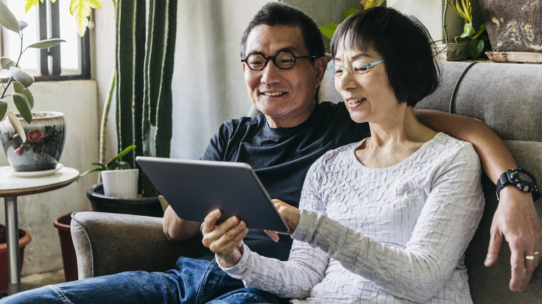 couple looking at ipad