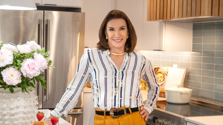Hilary Farr posing in a kitchen.