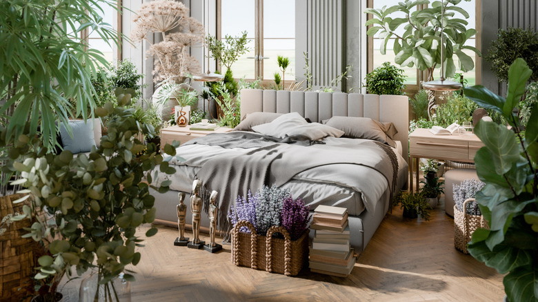 A cozy bedroom with lots of plants