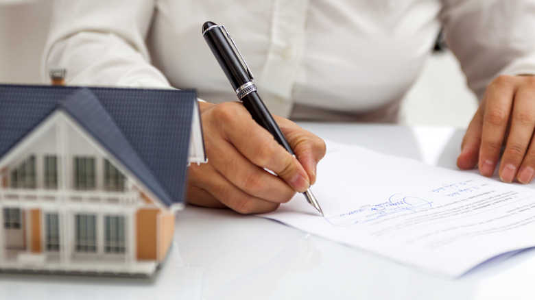 people signing document