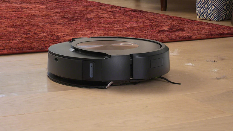 An iRobot Roomba Combo j9 Max Robot Vacuum cleaning a floor