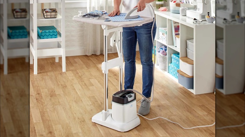 A Rowenta IXEO All in One Iron & Steamer standing in the middle of a room