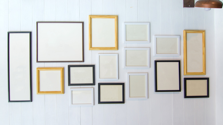 Mismatched photo frames on wall