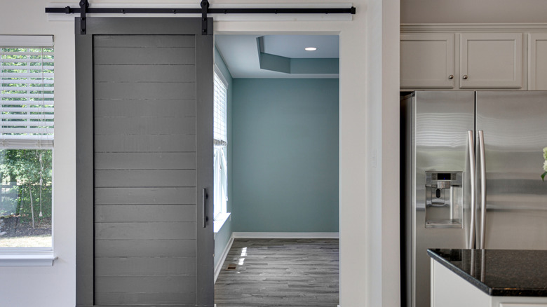 Grey barn door in a kitchen