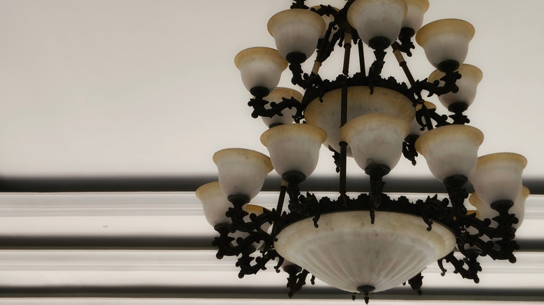 Ornate layered light fixture hanging from the ceiling