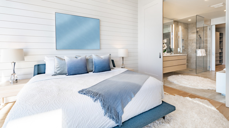 Bedroom with several throw pillows