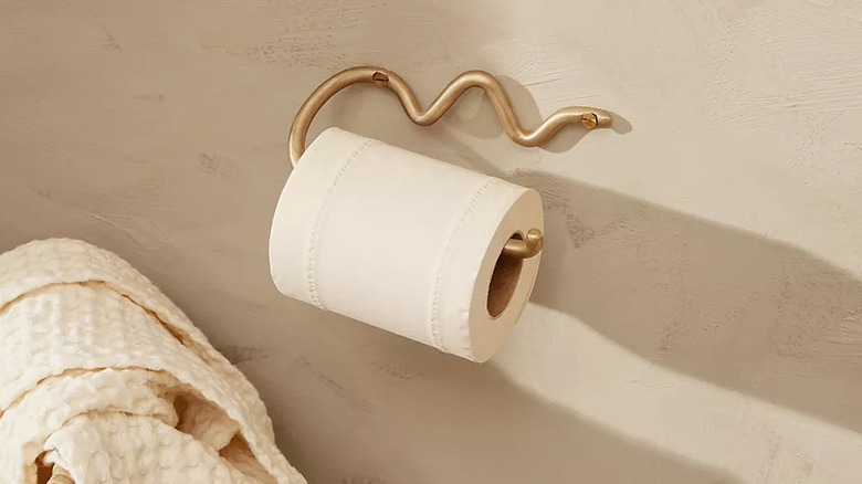 squiggle brass toilet paper holder