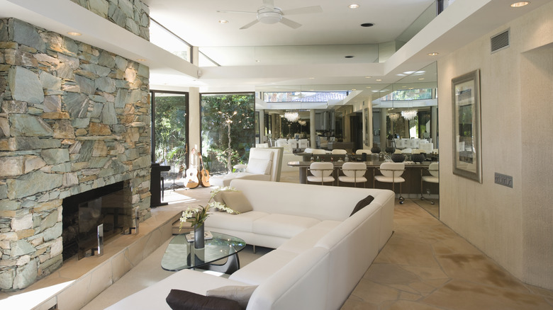 This sunken seating area is well placed in front of the fireplace.