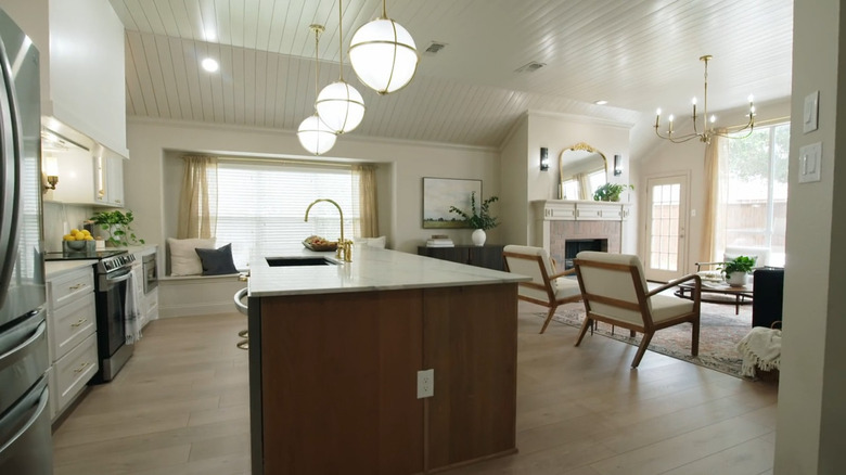 An open floor plan with unifying curtains