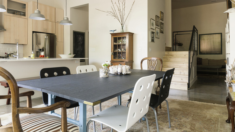A dining area with mix and matched furniture