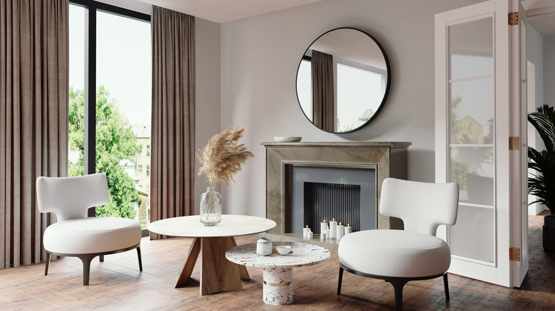 A living room with bold curtains and mirror on the wall
