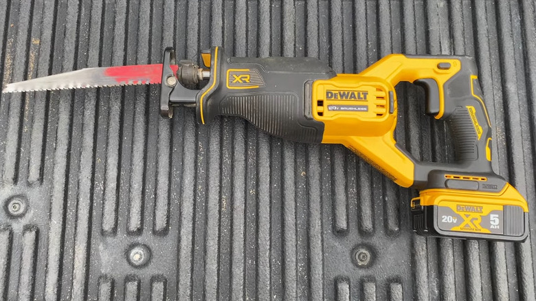 View of a DeWalt reciprocating saw on a ribbed surface