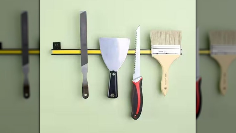 Everbilt magnetic storage bar being used for painting tools
