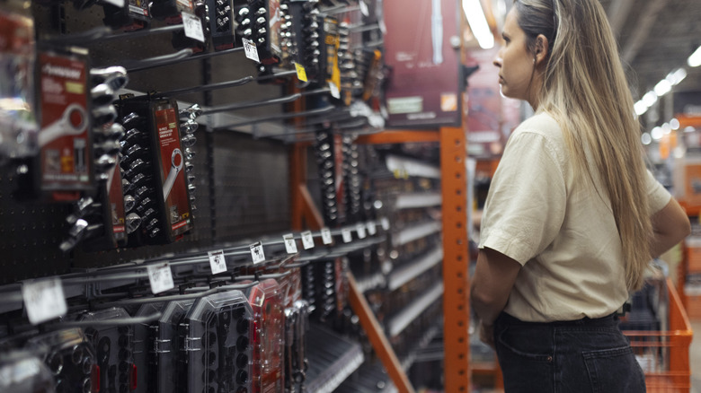 Woman shops for tools at Home Depot