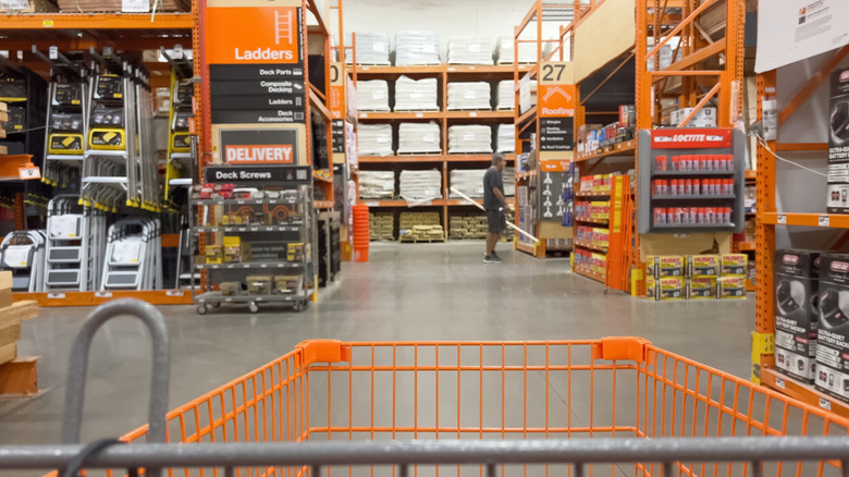 interior POV shot of shopping at orange-themed home improvement store