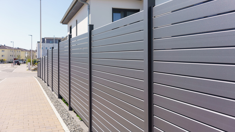 Modular privacy fence near a house