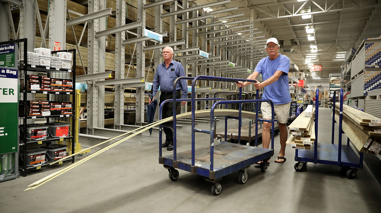 man buying lumber at Lowe's