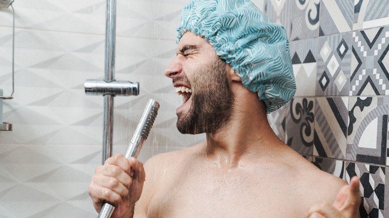 man singing in shower