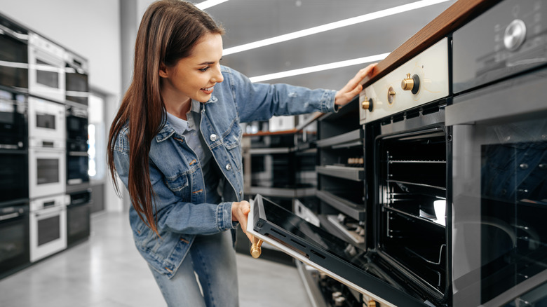 Person shopping for stoves