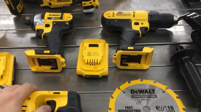 tools from a DeWalt 20V Max 10-Tool Combo Kit on a wood slat floor