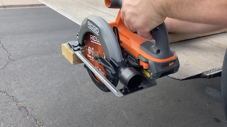a Ridgid circular saw cutting a 2-by-4
